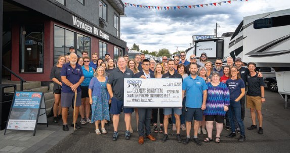 Friesen and Fraser with their Voyager Staff presenting a $17,250 cheque to BC Cancer Foundation as part of their Voyager Cares initiative - Sept 2023.